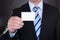 Close-up of businessman holding visiting card