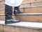 Close up of businessman legs walk up the stone staircase. Arab businessman