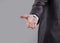 Close up. the businessman reaches out to the partner . on grey background