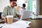 Close Up Of Businessman Reaching For Cup Of Coffee In Office