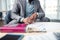 Close up of businessman sitting near calendar while scheduling meeting