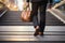 Close up of a businessmans legs ascending stairs, symbolizing confidence and business growth