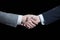 Close up of businessmen handshake - partnership, negotioation