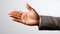 Close up of businesswoman hand showing thumb up sign on grey background