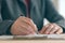 Close up of businesswoman hands signing contract and business agreement