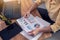 Close up of a businesswoman hands working at home with Business documents papers, financial statistics reports graphs and charts