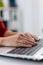 Close up of businesswoman manager hands fingers typing