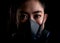 Close up businesswoman of young Asia woman putting on a respirator N95 mask to protect from airborne respiratory diseases as the