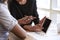 Close Up Of Businesswomen Using Digital Tablet In Meeting