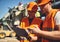 Close up of busy builders frowning and looking at documents