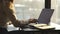 Close-up of busy female hand typing on keyboard while sitting at her working place in the office