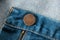 Close up button and zipper. blue jeans denim texture and background.