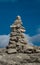 Close up on cairn, sign on mountain path