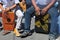 Close-up of a cajon, man\'s legs and hands are shown as he\'s playing the instrument