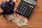 Close-up of a calculator, euro bills and diy facemask, designed as an Europian Union flag.