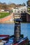 Close up of canal boat iron chimney with flight of locks