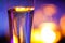 Close-up of candlelit glass with sparkling champagne