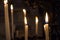 Close up of candles burning inside the Saint Bavo Cathedral or Sint-Baafs Cathedral in Ghent, Belgium, Europe. Spirituality