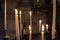 Close up of candles burning inside the Saint Bavo Cathedral or Sint-Baafs Cathedral in Ghent, Belgium, Europe. Spirituality