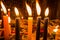 Close up of candles over a metallic structure inside of Santo Domingo Church in Quito, Ecuador