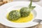 Close-up of canederli with spinach served in soup - bread dumplings