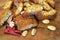 Close up on the cantucci or cantuccini with Santa toy on wooden background. Cantuccini are typical Tuscan dry biscuits, made with