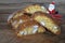 Close up on the cantucci or cantuccini with Santa toy on wooden background. Cantuccini are typical Tuscan dry biscuits, made with