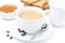 Close-up of cappuccino, milk, fresh toast and jam on white