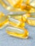 Close up capsules fish oil in Glass bottle .The supplement high