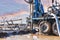 Close-up of a car-based drilling rig at a construction site. Drilling deep wells for mining.. Working process of drilling a well