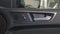 The close up of car door inner panel, door opener and buttons.