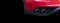 Close up of a car dual exhaust pipe. Double exhaust pipes of a red modern sports car. Car exterior details. New car parts with