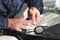 Close up Car glaze worker fixing and repairing a windshield or windshield of a car at a garage service station. Drill