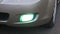 Close-up of the car included fog lights. Slow motion. Headlights in the car.