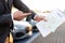 Close-up of car keys and car papers in front of new cars at a car dealership