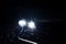 Close up car lights at night. Rainy weather.