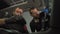 Close-up of car wash workers, two workers wipe the interior of the car from dirt and germs, detailed interior decoration