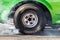 Close up car wheel with smoke on the asphalt road speed track, Car wheel drifting and smoking on track, Car wheel spinning