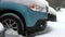 Close up of car wheels stuck in snow drift.