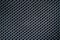 Close up of carbon fiber textile texture. Very strong fabric background