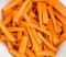 Close up of Carrot sticks in a white bowl - healthy root vegetable