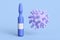 Close-up of a cartoon ampoule of coronavirus vaccine on a blue background.