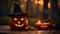 Close up of a carved and glowing Pumpkin with a Witch Hat on a wooden Table standing beside a Candle. Scary Halloween Backdrop.