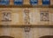 Close up of carved medieval figures on the  medieval town hall in the centre of Paray Le Monial, Burgundy, France