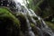 close-up of cascading waterfalls, with droplets falling in slow motion