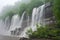 close-up of cascading waterfalls, with mist and spray visible