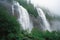 close-up of cascading waterfalls, with mist and spray visible