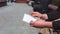 Close up of cash in envelope in hands. Money bonus in a paper envelope. A man holding an envelope with money. World