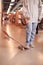 Close Up Of Casually Dressed Young Businesswoman With Skateboard Standing In Open Plan Workplace