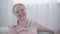 Close-up of Caucasian adult woman laughing. Portrait of cheerful lady having fun alone indoors. Lifestyle, joy